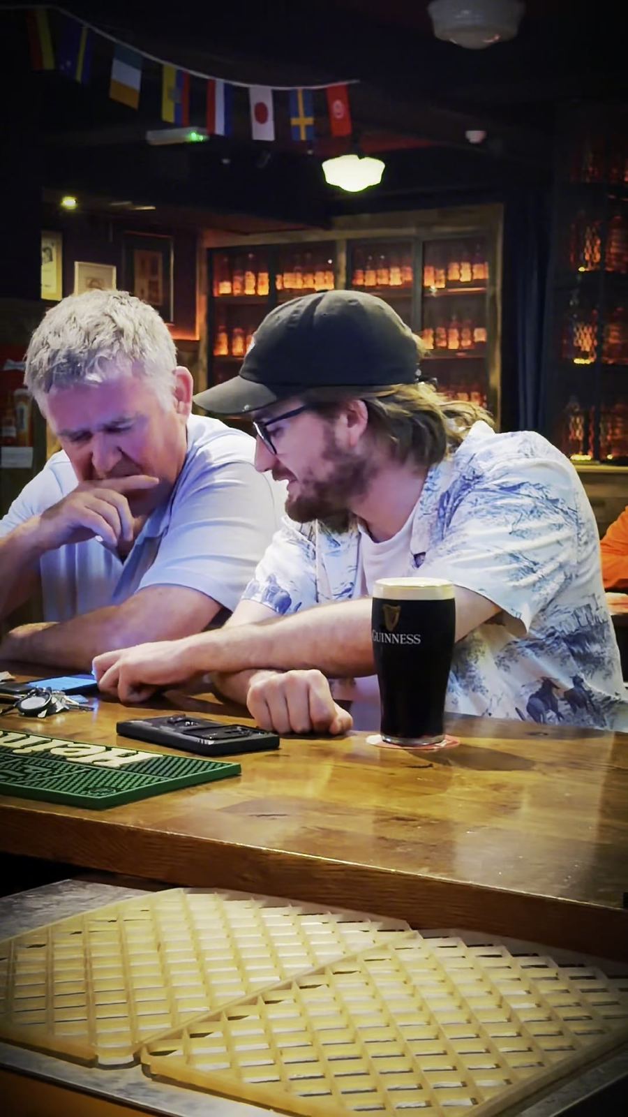 Locals chatting over pints at the bar