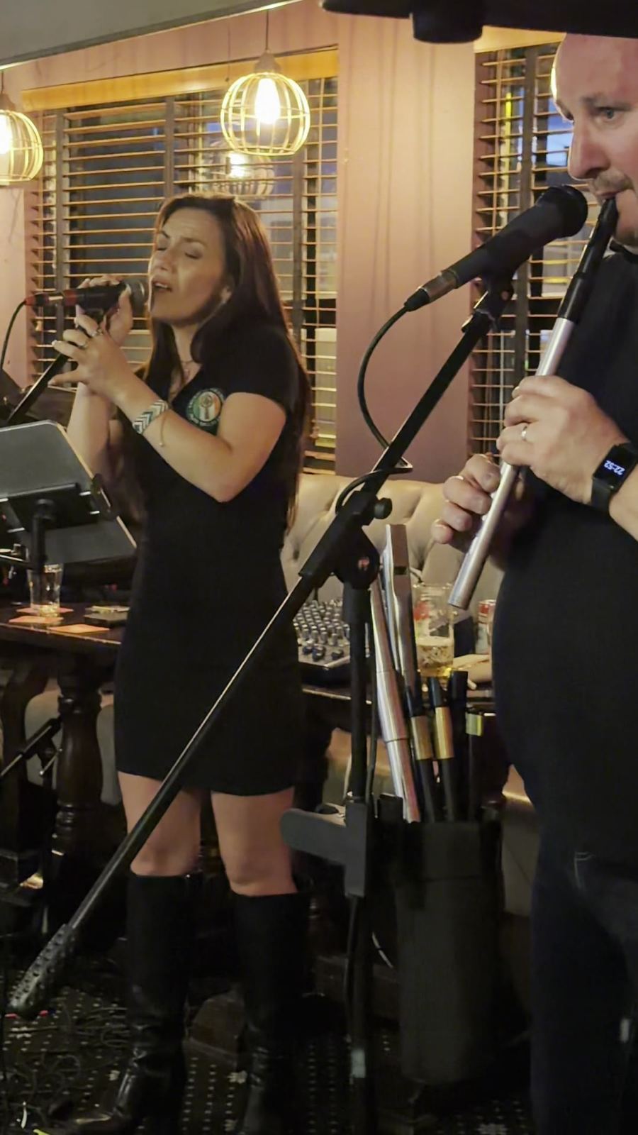 A singer and musician performing live
